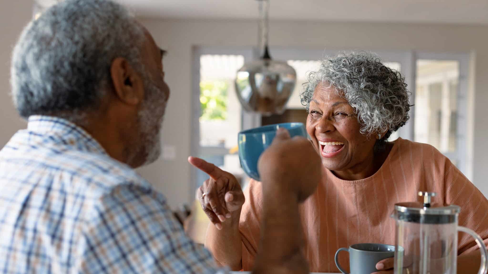 senior couple happy after reverse mortgage counseling