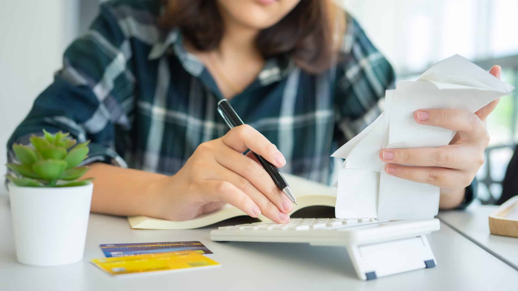 woman assessing credit card debt wondering how it affects her credit score