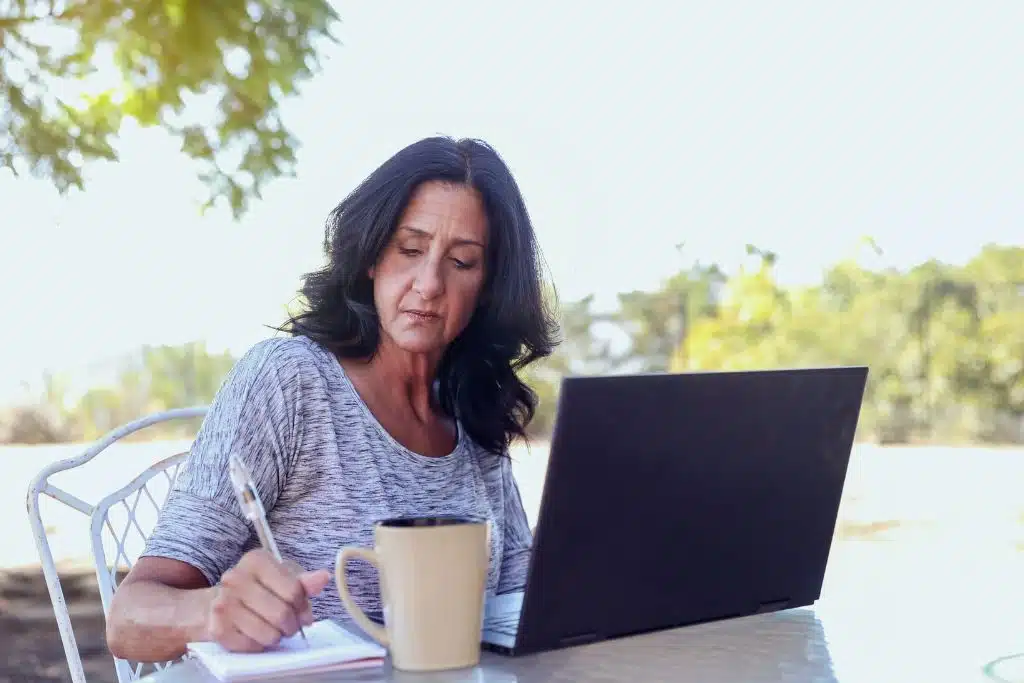 Person considering reaching out for help with debt