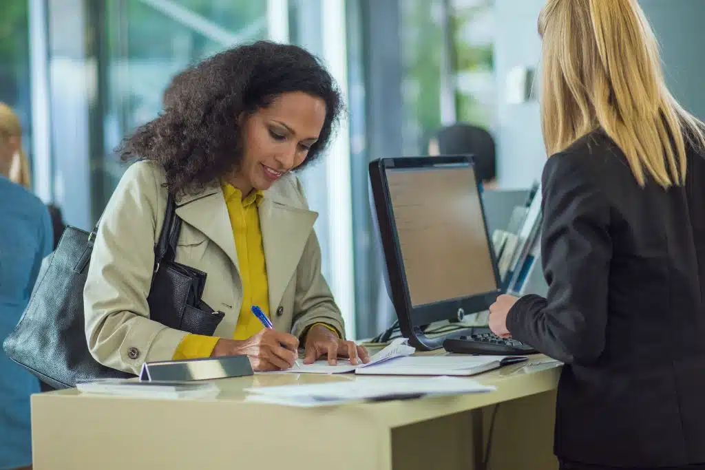 Young woman opening a savings account using a mobile app