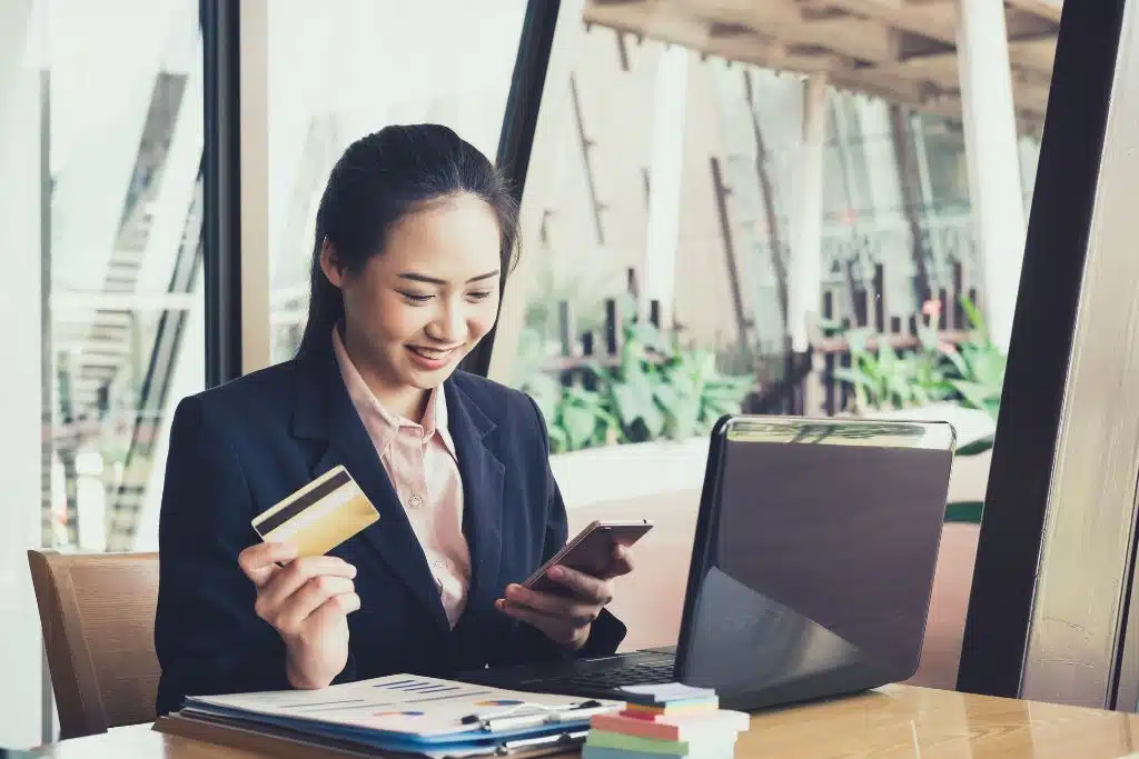 Man checking his bank statement and smiling about zero fees