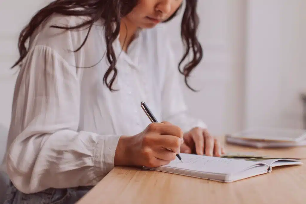 Person comparing monthly costs of renting vs buying a home