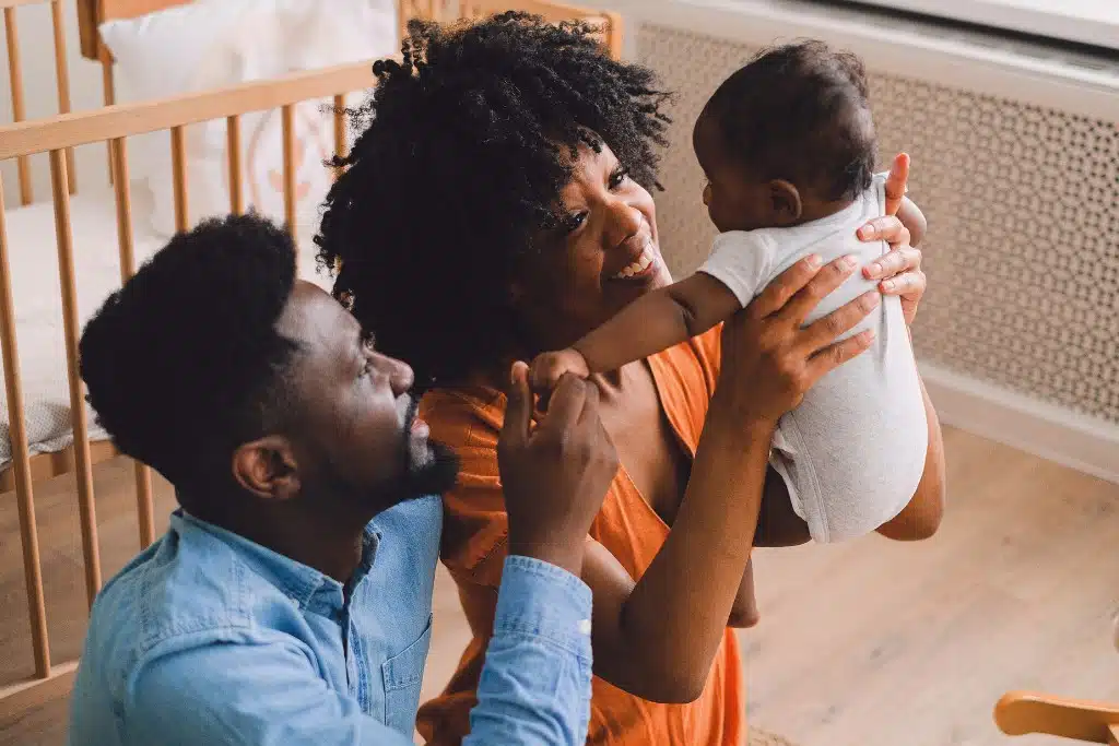 Expectant parents reviewing budget and baby expenses together