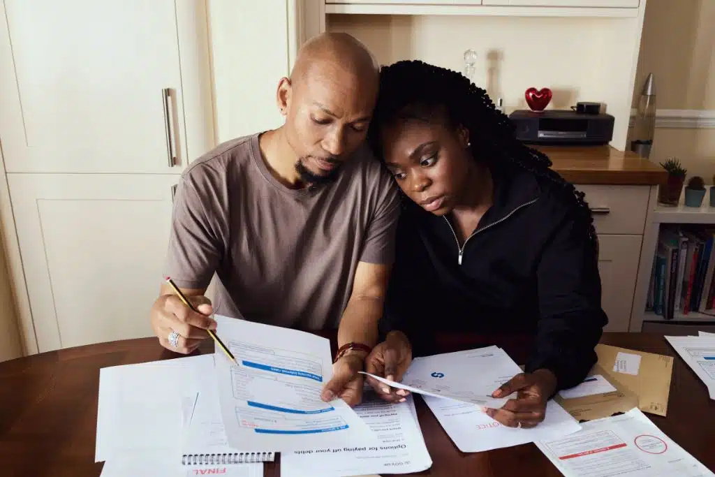Woman making an extra loan payment on her laptop at home