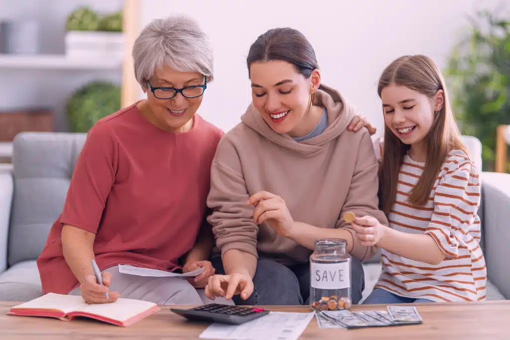 Mother and two daughters of different ages having a positive conversation about money together